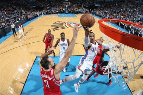 evolution at nba game|Broad sweep of NBA illustrates game's transition.